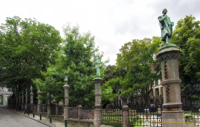 The Petit Sablon Garden is enclosed by a wrought iron fence decorated with statues